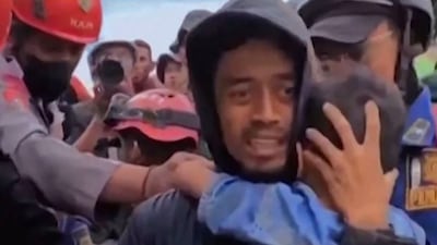 A boy, six, is pulled out of the rubble in Cianjur, West Java, after a 5.6-magnitude earthquake that hit the area this week, killing at least 271 people, many of them children. AFP