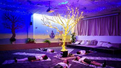 Students practice centering themselves and calming their minds at Greenfield Community School