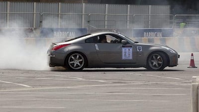 Mark Luney of Belfast drifts a Nissan 350z at the Barbican Turbo Show in Abu Dhabi.