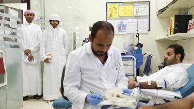 Donors wait to play their part by donating blood at Latifa Hospital in Zabeel on Friday. Antonie Robertson / The National