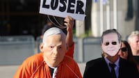 Protesters dressed as Israeli Prime Minister Benjamin Netanyahu and President Isaac Herzog protest after Netanyahu's pardon request at the Tel Aviv Magistrate's Court. EPA