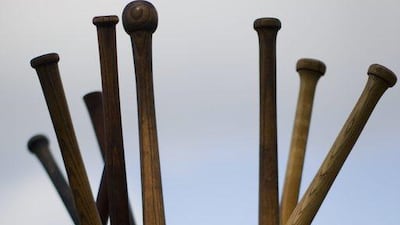 They pitch underhand. No one is using a batting helmet, fielding glove or catcher's mask. And there is a plethora of floppy hats and groomed mustaches, in the style of baseball's mid-19th century beginnings. Matt Rourke / AP