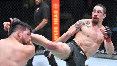 Robert Whittaker of Australia kicks Kelvin Gastelum in a middleweight fight during the UFC Fight Night event at UFC APEX in Las Vegas, Nevada. Chris Unger/Zuffa LLC
