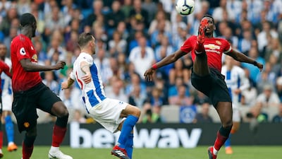 Paul Pogba is challenged by Brighton mifielder Pascal Gross. AP Photo