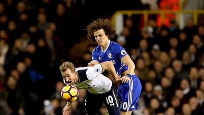 Harry Kane of Tottenham Hotspur tussles with David Luiz of Chelsea. David Klein / AP Photo