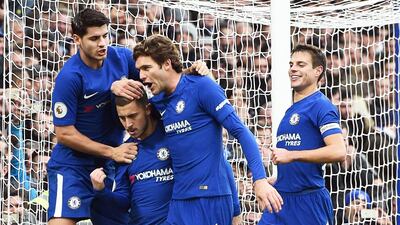 Eden Hazard, second left, celebrates with his teammates after scoring the penalty that gave Chelsea a 3-1 against Newcastle United. Facundp Arrizabalaga / EPA