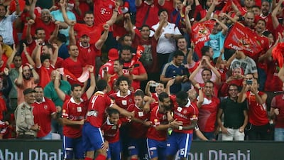 Al Ahly players celebrate after scoring a second goal during the Egyptian Super Cup at Hazza Bin Zayed Stadium in Al Ain on Thursday night. AFP PHOTO / MARWAN NAAMANI