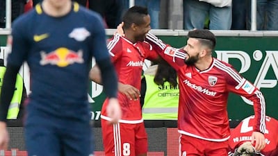 Roger de Oliveira Bernardo, centre, and teammate Anthony Jung, right, of Ingolstadt celebrate after the opening goal against RB Leipzig at the Audi Sportpark in Ingolstadt, Germany, on December 10, 2016. Armin Weigel / AP