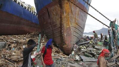 Haiyan, one of the most powerful storms on record, slammed into six central Philippine islands, leaving a swathe of destruction and thousands dead. Aaron Favila / AP
