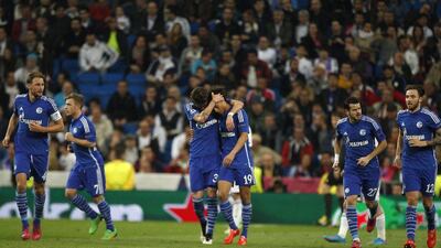 Schalke's Leroy Sane, center right, celebrates with teammates after equalising for his club 3-3 against Real Madrid on Tuesday night in the Champions League. Andres Kudacki / AP