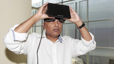 Clyde DeSouza with thew virtual reality headset he believes will make learning more interactive. Jeffrey E Biteng / The National