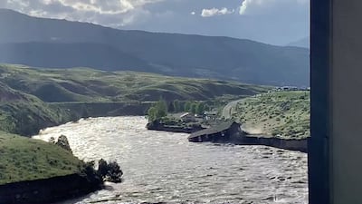 A house falls into the Yellowstone River due to flooding in Gardiner, Montana. Angie Lilly/ Reuters