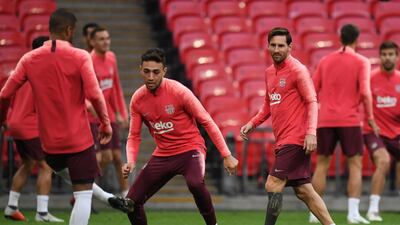 Lionel Messi and Munir El Haddadi, centre, take part in a training session. EPA