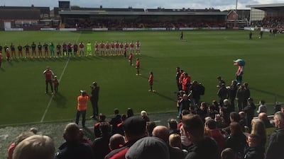 Tenor Alfie Boe sings the English national anthem as the players and Fleetwood’s mascot Captain Cod look on. Andy Mitten for The National