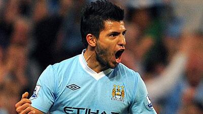 Sergio Aguero celebrates scoring after coming off the bench on his debut against Swansea City.