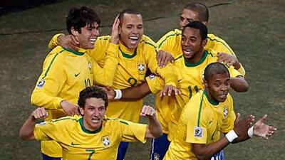 Elano, No 7, celebrates his goal with his Brazil teammates during the victory over Ivory Coast at Soccer City last night.