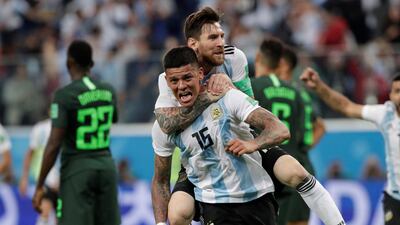Marcos Rojo celebrates scoring Argentina's second goal with Lionel Messi during the 2-1 win over Nigeria. Reuters