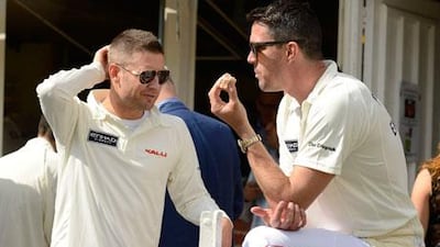 Michael Clarke, left, and England's Kevin Pietersen are both missing out of the ongoing ICC Champions Trophy with injuries. Philip Brown / Reuters