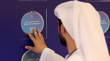 Visitors attend the Dubai Future Forum at Dubai's Museum of the Future. A new report says the UAE's tech push will create the need for more workers. Chris Whiteoak / The National.