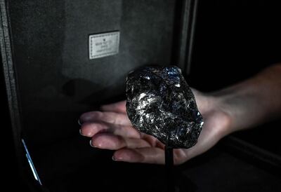 The gem is still coated in carbon. AFP
