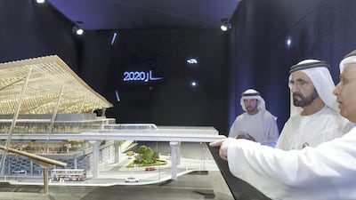 Mattar Al Tayer shows Sheikh Mohammed bin Rashid and Sheikh Hamdan bin Mohammed the design for the main expo station. Wam