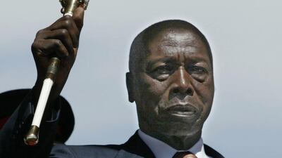 Outgoing Kenyan President Daniel arap Moi salutes during a swearing-in ceremony for President-elect Mwai Kibaki December 30, 2002 in Nairobi, Kenya. The December 27, 2002 general elections ended Moi's 24-year rule. Photo by Alessandro Abbonizio/Getty Images.