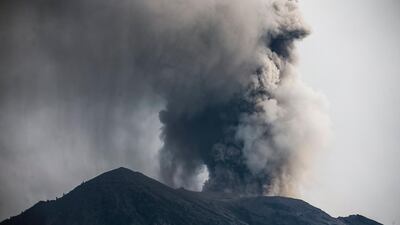 The Mount Agung volcano spews hot volcanic ash, as seen from the Besakih Temple in Karangasem, Bali, Indonesia, on November 28, 2017. Made Nagi / EPA