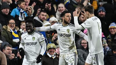 Leeds United striker Wilfried Gnonto (L) celebrates with teammates after scoring the first goal in their FA Cup third round replay victory against Cardiff at Elland Road on January 18, 2023. AFP