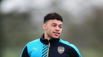 Alex Oxlade-Chamberlain of Arsenal warms up during the team’s training session on Tuesday ahead of Wednesday’s match against Olympiakos. Dan Mullan / Getty Images