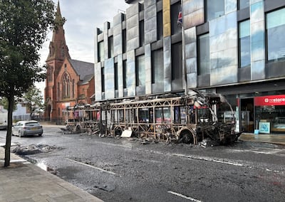 A burnt-out bus in east Belfast after violence on Tuesday night. PA