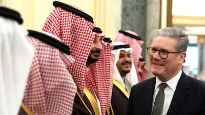 Mr Starmer meets Saudi officials as he arrives at the Royal Court in Riyadh. Getty Images