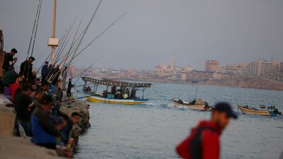 Palestinian men fish in the Gaza port of Gaza City. AP Photo