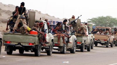 epa06805315 Yemeni forces backed by the Saudi-led coalition take position during an attack on the port city of Hodeidah, on the outskirts of Hodeidah, Yemen, 13 June 2018. According to reports, Yemeni government forces backed by the Saudi-led coalition launched a military offensive to regain control of the Red Sea port-city of Hodeidah acts as an entrance point for Houthi rebel supplies and humanitarian aid. EPA/NAJEEB ALMAHBOOBI