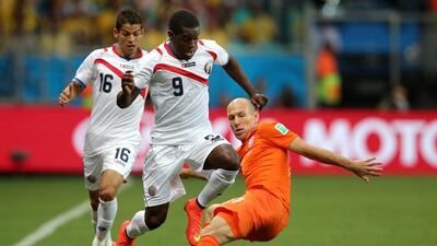 Joel Campbell of Costa Rica is challenged by Arjen Robben of the Netherlands during their match on Saturday at the 2014 World Cup in Salvador, Brazil. Dean Mouhtaropoulos / Getty Images