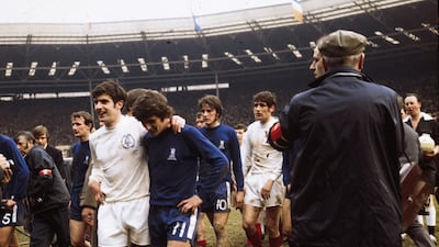 Members of Chelsea and Leeds United walking off the pitch at Wembley Stadium after their 2-2 draw in the FA Cup final. Chelsea won the replay. Getty