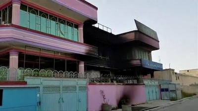 A still from a video shows a burned building after Taliban attacks in Ghazni City. Ariana News via Reuters