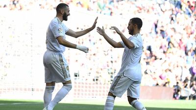 Real Madrid's French forward Karim Benzema, left, celebrates scoring the opening goal. AFP