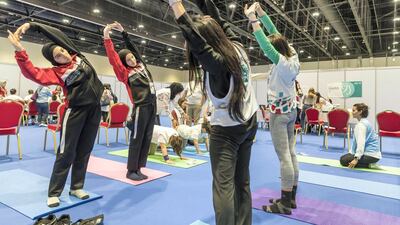 Athletes take part in a yoga session intended to help them focus and relax. The Body Tree area is a yoga and deep breathing section to help with stress and tension. Antonie Robertson / The National