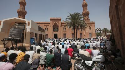 Men pray at the Grand Mosque in Khartoum. AP