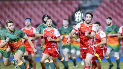 Dubai Knights Eagles take on Dubai Tigers, in red, in the West Asia Premiership at Dubai Sports City on Friday. The Tigers won 27-16. All photos by Victor Besa / The National