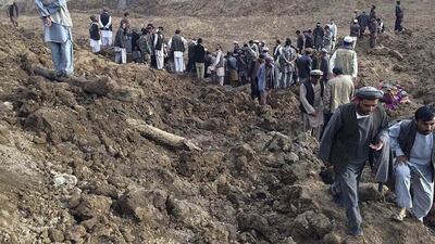 Afghan villagers gather at the site of a landslide at the Argo district in Badakhshan province on May 2, 2014, that killed at least 350 people, according to the UN. Reuters