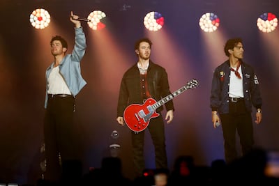 The Jonas Brothers, from left, Nick, Kevin and Joe, performing in Colombia in 2024. EPA