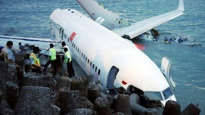 A Lion Air Boeing 737 lies partially submerged in the water three days after it crashed while trying to land at Bali's international airport near Denpasar.