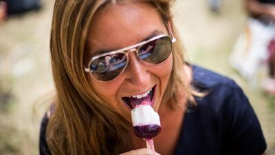 Hannah Shiffman enjoying an ice cream in Soho Square in London, England. The Met Office are predicting that July 1, 2015 could be the hottest day of the year with temperatures in the capital topping 35ºC. Rob Stothard/Getty Images