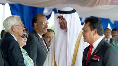Sheikh Mohammed and his delegation were welcomed at a ceremony in Putrajaya. Courtesy AFP