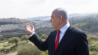 Israeli Prime Minister Benjamin Netanyahu stands at an overview of the Israeli settlement of Har Homa where he plans to build thousands of new homes despite most of the world seeing the constructions illegal. AFP