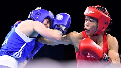 India's Mary Kom, right, beat Northern Ireland's Kristina O'Hara in the women's 45-48kg Commonwealth Games final. Anthony Wallace / AFP