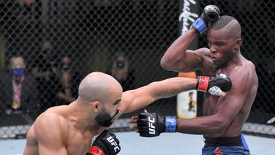 Ottman Azaitar punches Khama Worthy in a lightweight UFC fight in Las Vegas, Nevada, in September 2020. Jeff Bottari/Zuffa LLC)