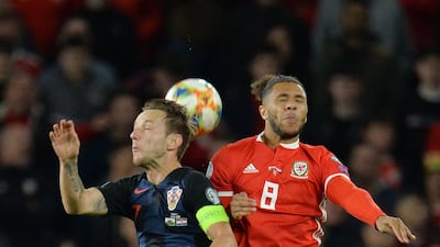 epa07919016 Wales Tyler Roberts (R) in action against Croatia's Ivan Rakitic (L) during the UEFA EURO 2020 group E qualifier soccer match between Wales and Croatia held at Cardiff City Stadium in Wales, Britain, 13 October 2019. EPA/PETER POWELL