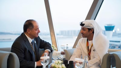 Sheikh Hazza bin Zayed speaks with Masoud Barzani, former president of Iraqi Kurdistan, during a reception at Shams Tower at the 2015 Abu Dhabi Grand Prix at Yas Marina Circuit. Mohammed Al Suwaidi / Crown Prince Court - Abu Dhabi